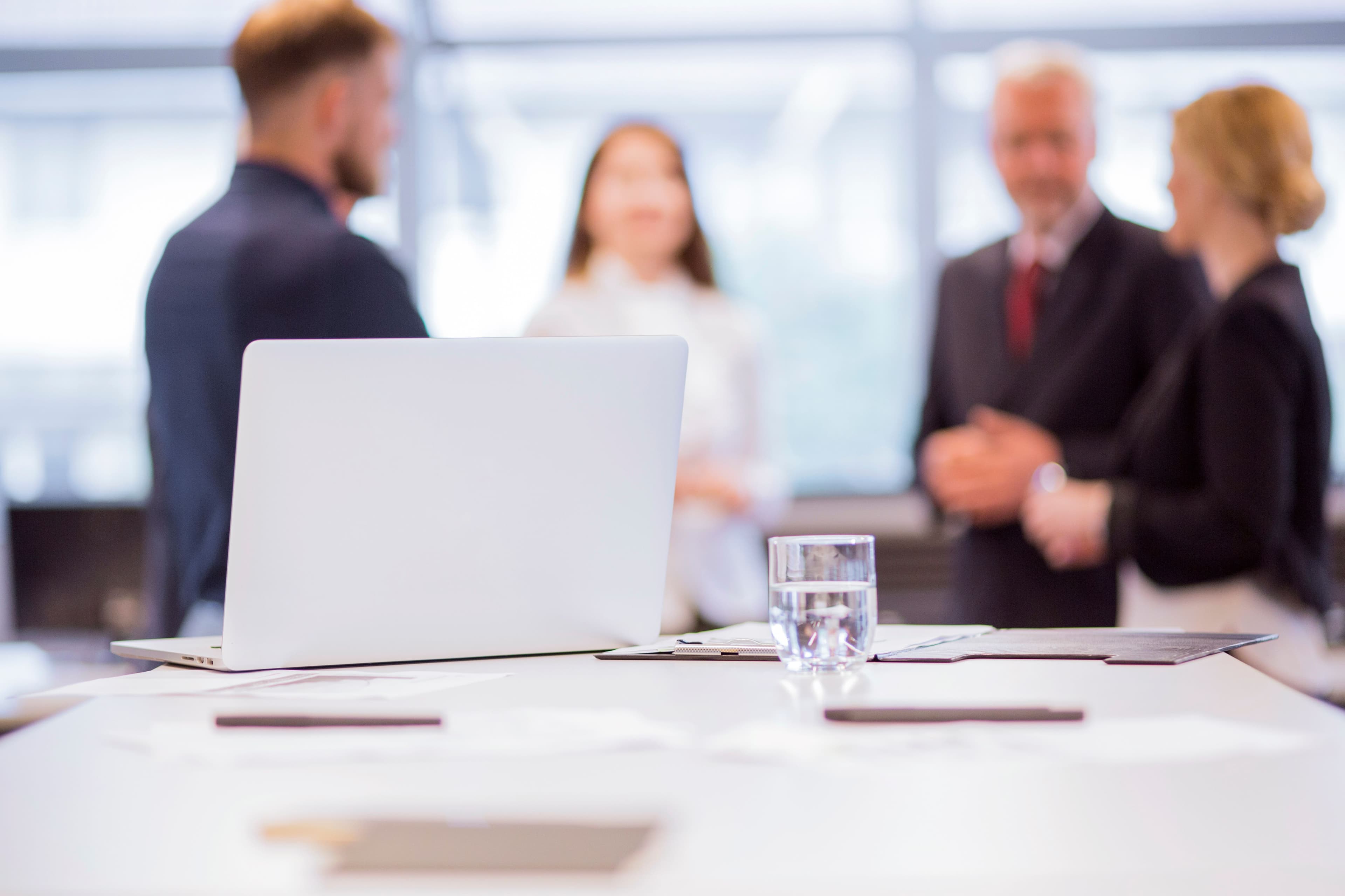 International Mobility of Faculty and Staff | UFV glass-water-with-laptop-table-front-businesspeople-background (1) International Mobility of Faculty and Staff | UFV Study at the Universidad Privada Madrid